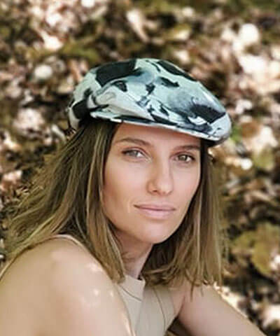 Model wearing Pandemonium Millinery Charlie Driving Cap | Linen in Black and White Floral | Handmade in Seattle WA