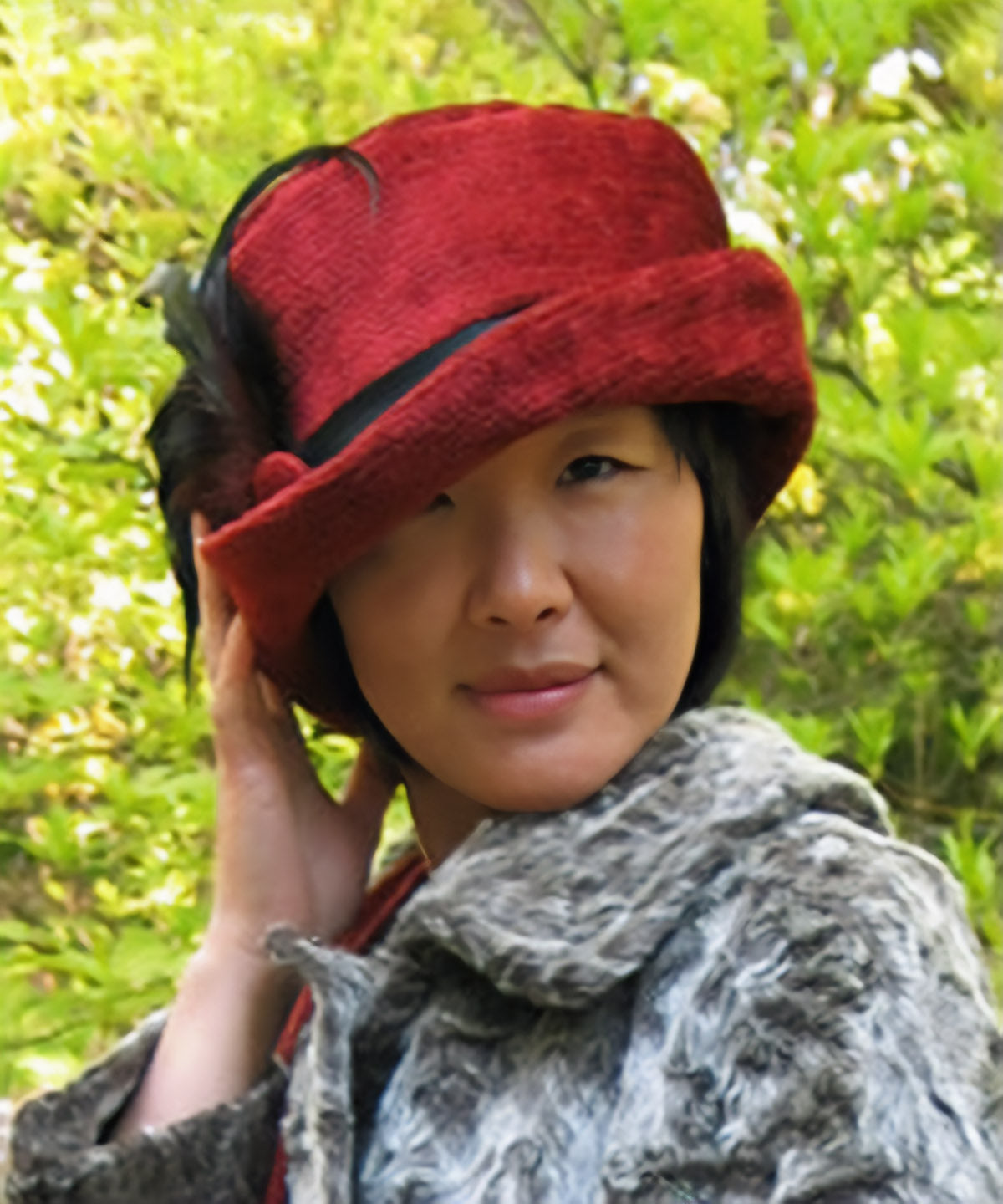 Woman wearing a Cleo Bucket Hat in red chenille | Handmade in Seattle WA | Pandemonium Millinery