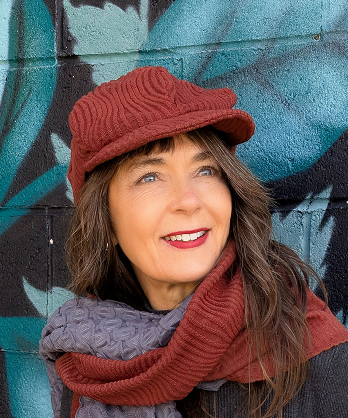 Woman wearing Dianne Cap shown in Burn Sienna Fractal Handmade in USA by Pandemonium Millinery