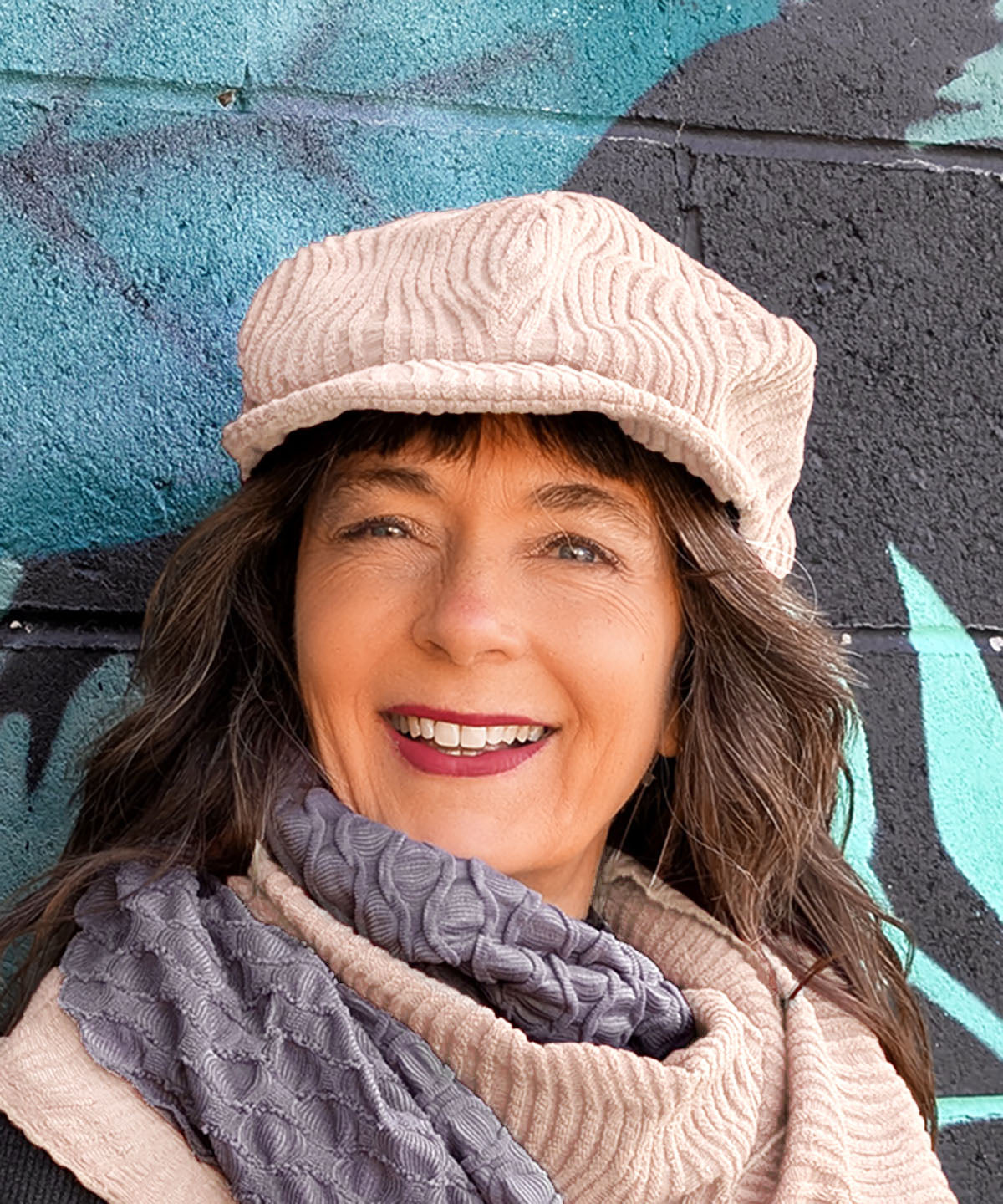 Woman wearing Dianne Cap shown in Blush Fractal Handmade in USA by Pandemonium Millinery