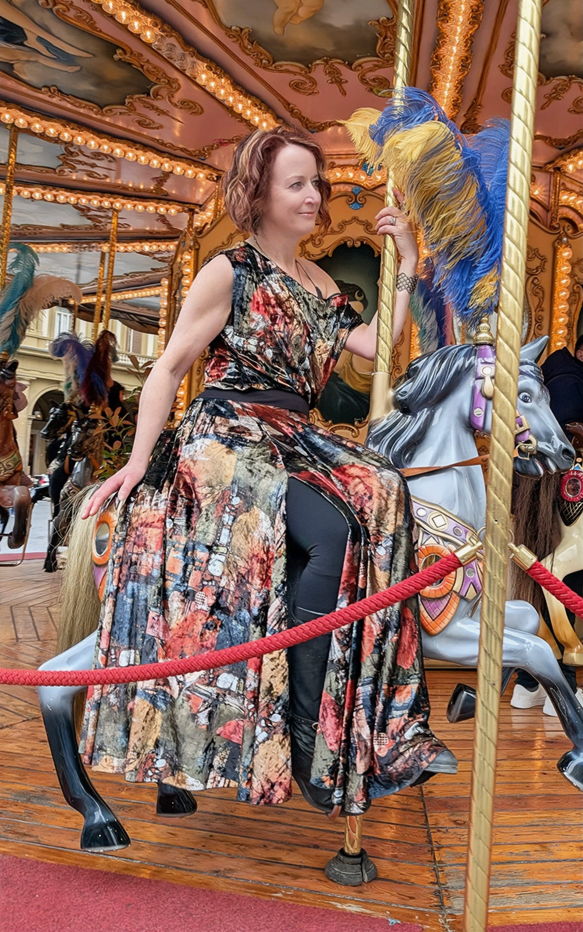 woman riding carousel in monarch circle skirt in grand canyon velvet handmade by LYC x Pandemonium in Seattle, WA, USA