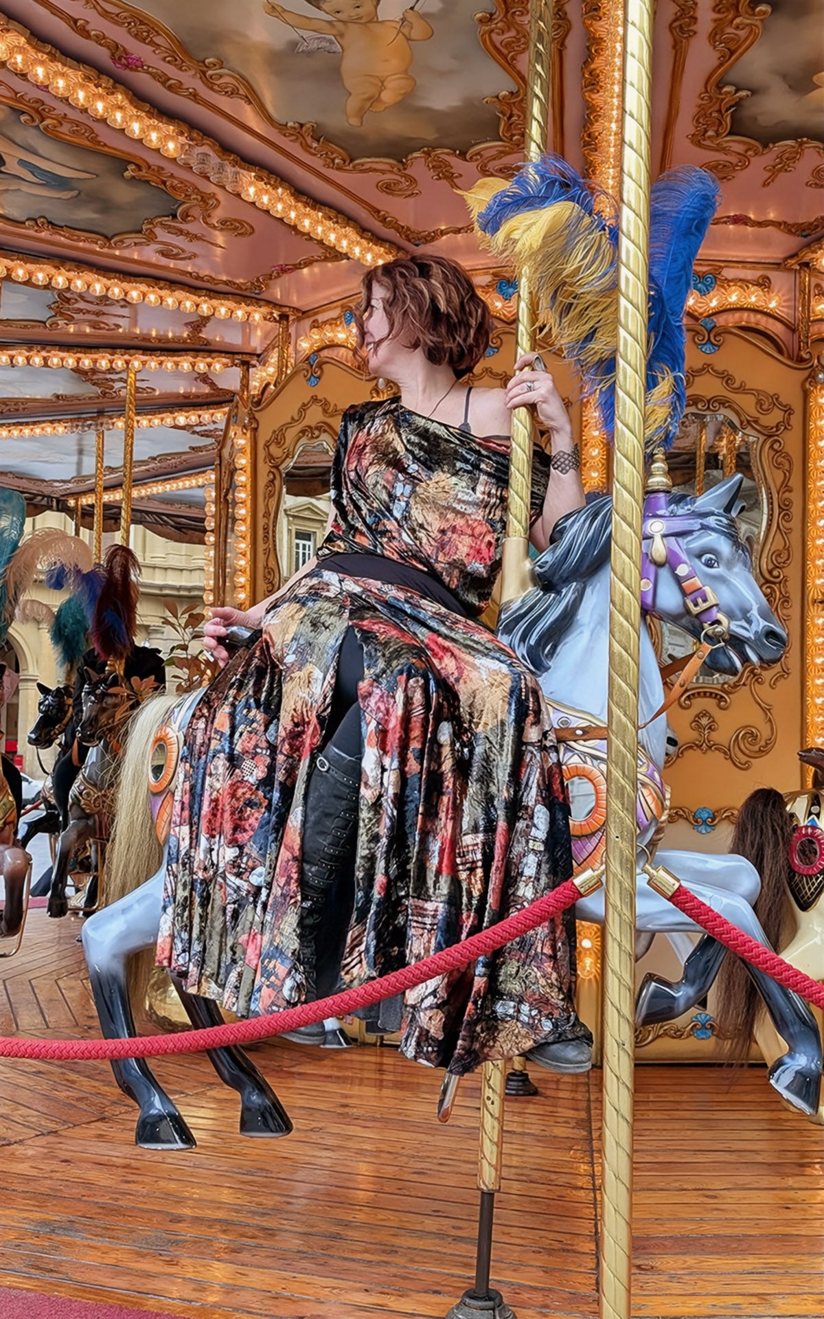 woman riding merry-go-round in monarch circle skirt in grand canyon velvet handmade by LYC x Pandemonium in Seattle, WA, USA