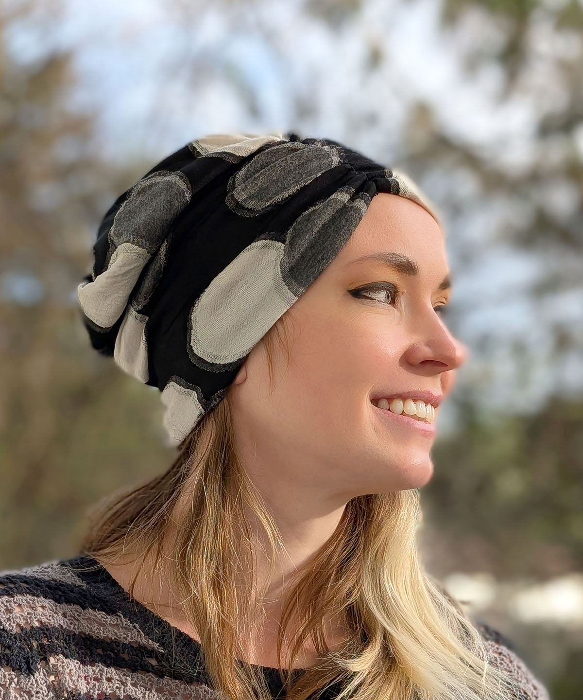 close up of woman wearing slouchy beanie in Super Nova black, white and gray knit handmade in the USA by Pandemonium Seattle