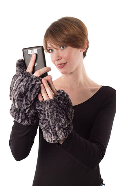 Model holding cellphone wearing flip top Mittens. Gauntlets, mitts | faux fur | Handmade by Pandemonium Millinery Seattle, WA USA