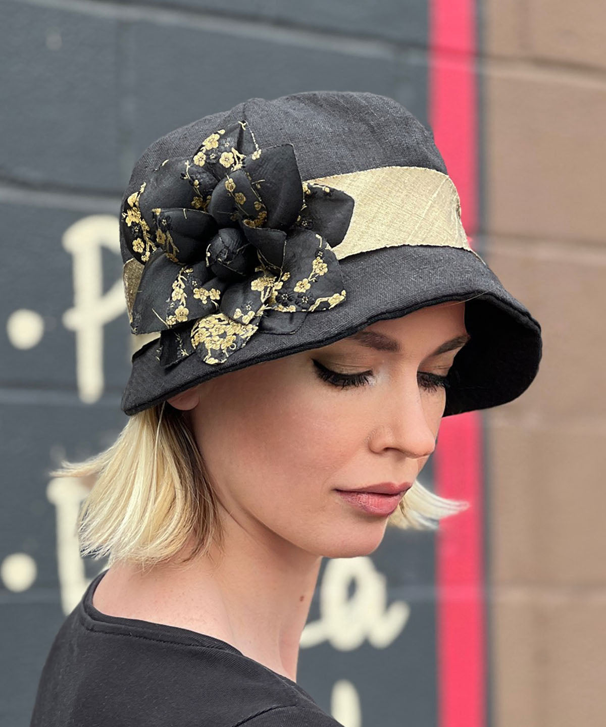 Model wearing Grace Cloche 1920s Style Hat Linen in Black with Black and Gold Kimono Flower Brooch | Seattle WA USA