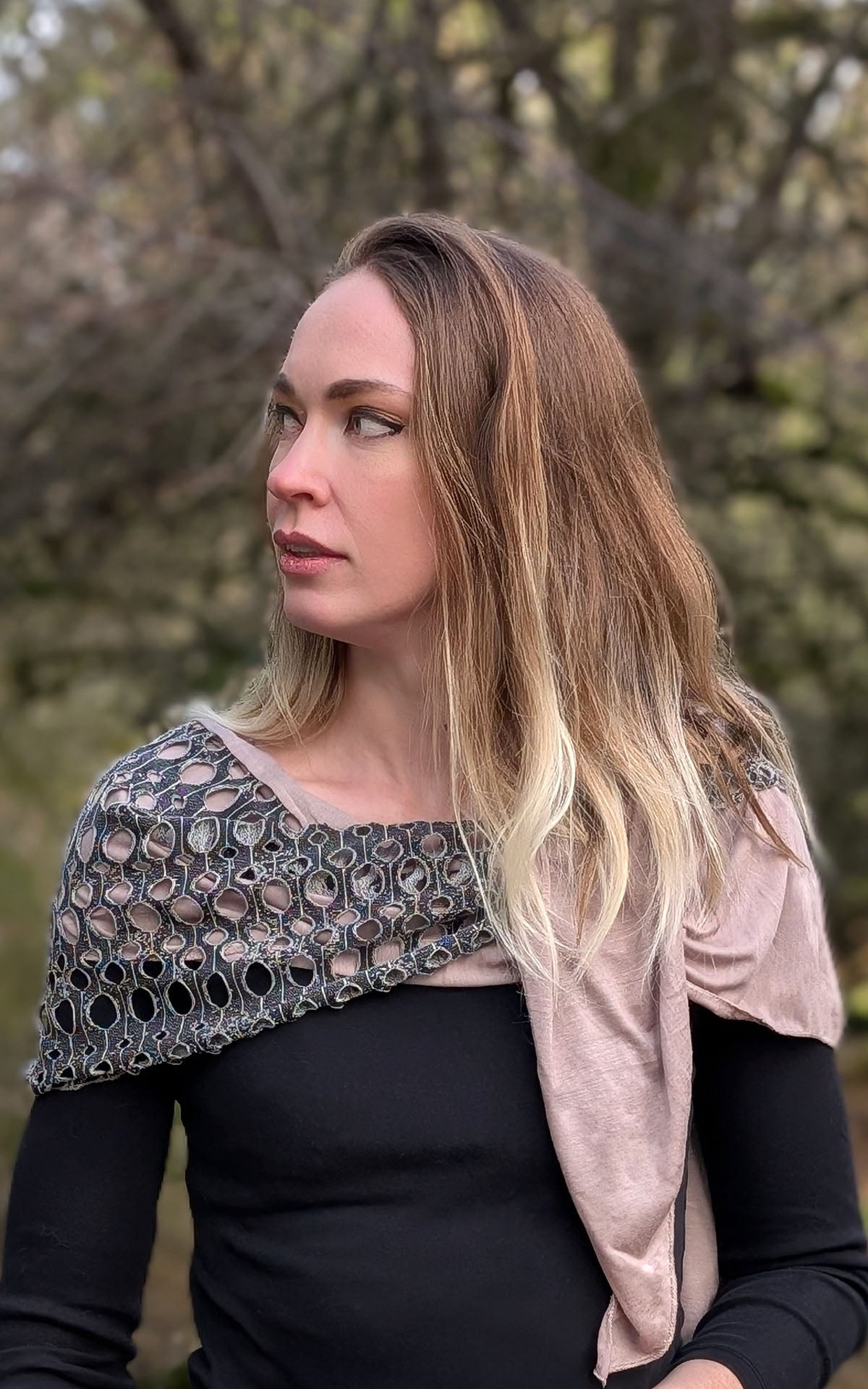 close up of Model wearing Two-Tone Handkerchief Scarf | Lunar Landing, a black and neutral knit with curled edges surrounding holes, paired with a light-weight lime Stardust Jersey Knit | Handmade in Seattle WA | Pandemonium Millinery