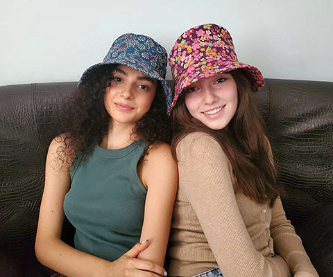Models feature Hollie Sun Hat in Porcelain Vase and Purple Hana. Handmade in USA by Pandemonium Seattle.