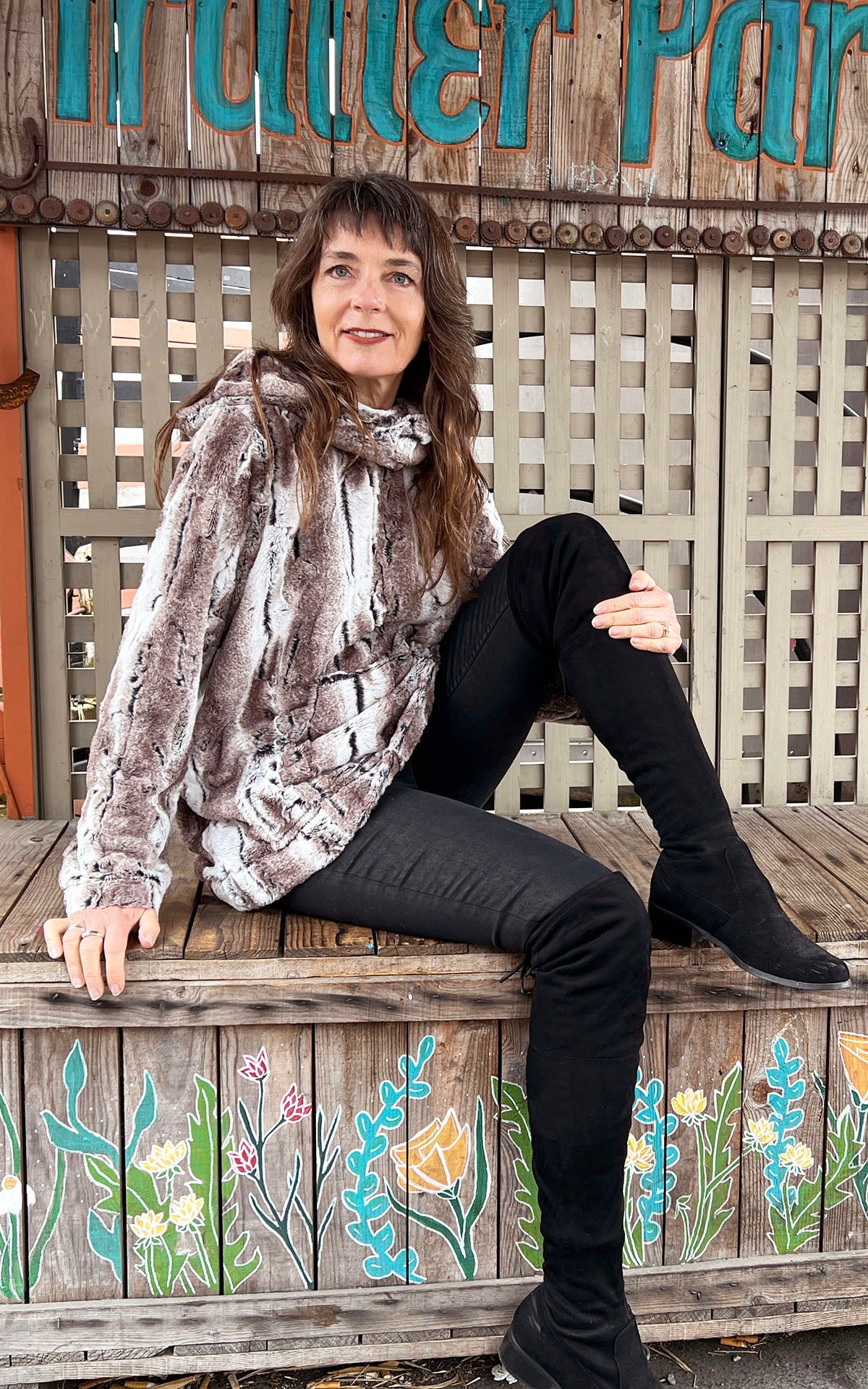 Model wearing Hooded Lounger - Luxury Faux Fur in Birch handmade in Seattle WA by Pandemonium Millinery.