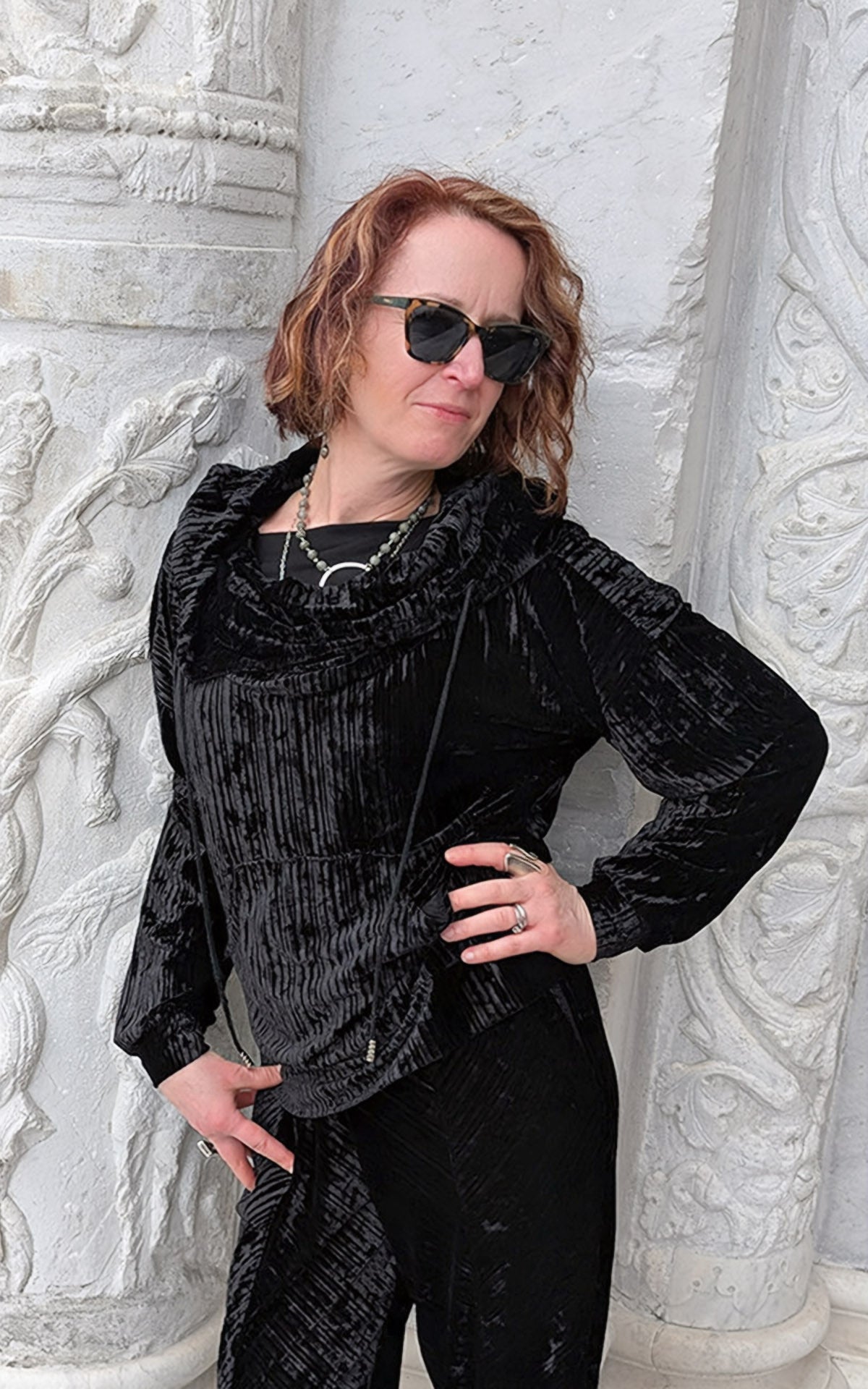 close up Woman wearing Slice of Life Hooded Sweatshirt in black Pleated Velvet with hood down handmade in USA by Pandemonium Seattle