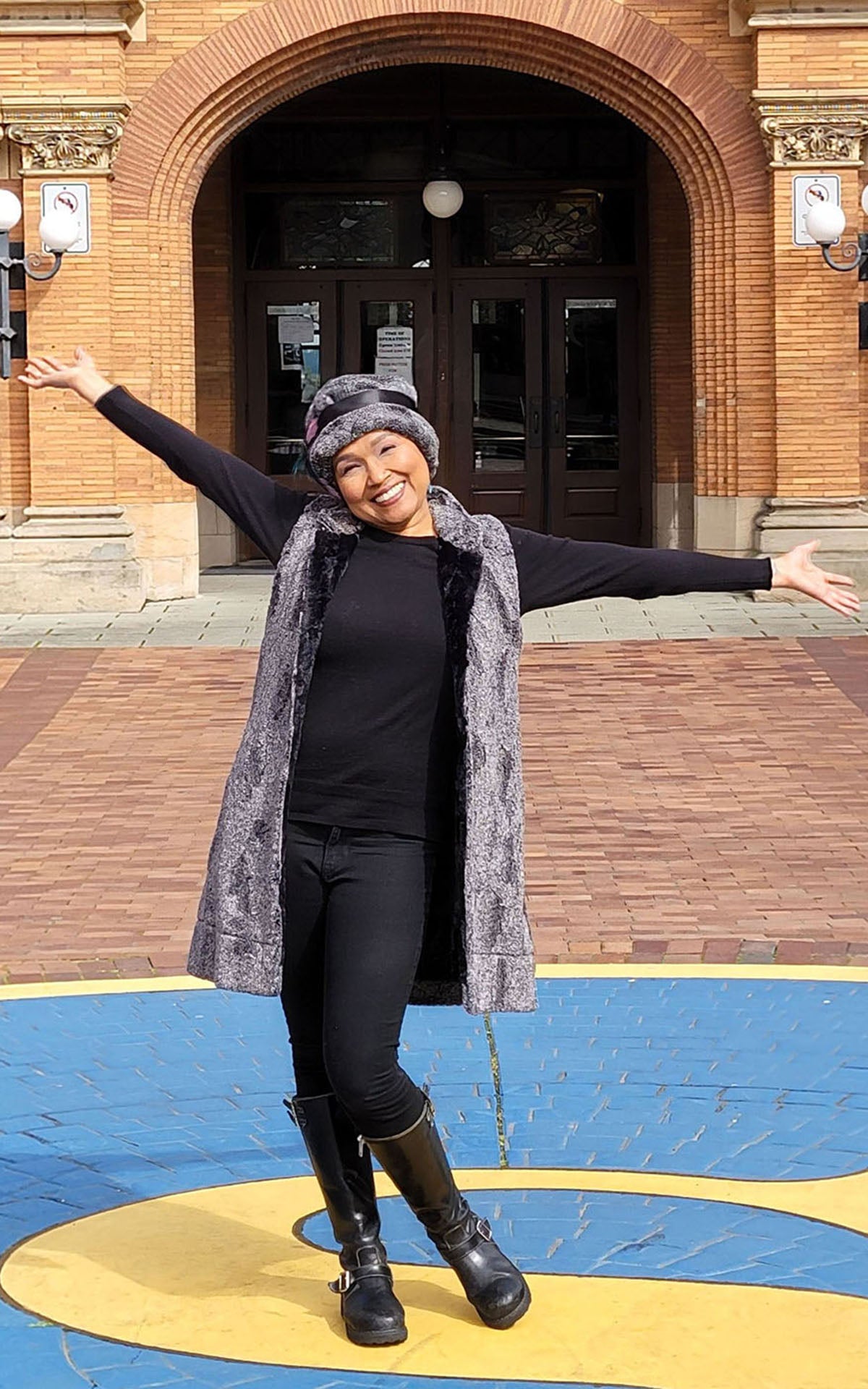 Woman wearing Mandarin Vest in Nimbus and Cuddly Black Faux Fur with a matching Cloche Hat. Handmade in Seattle, WA, USA.