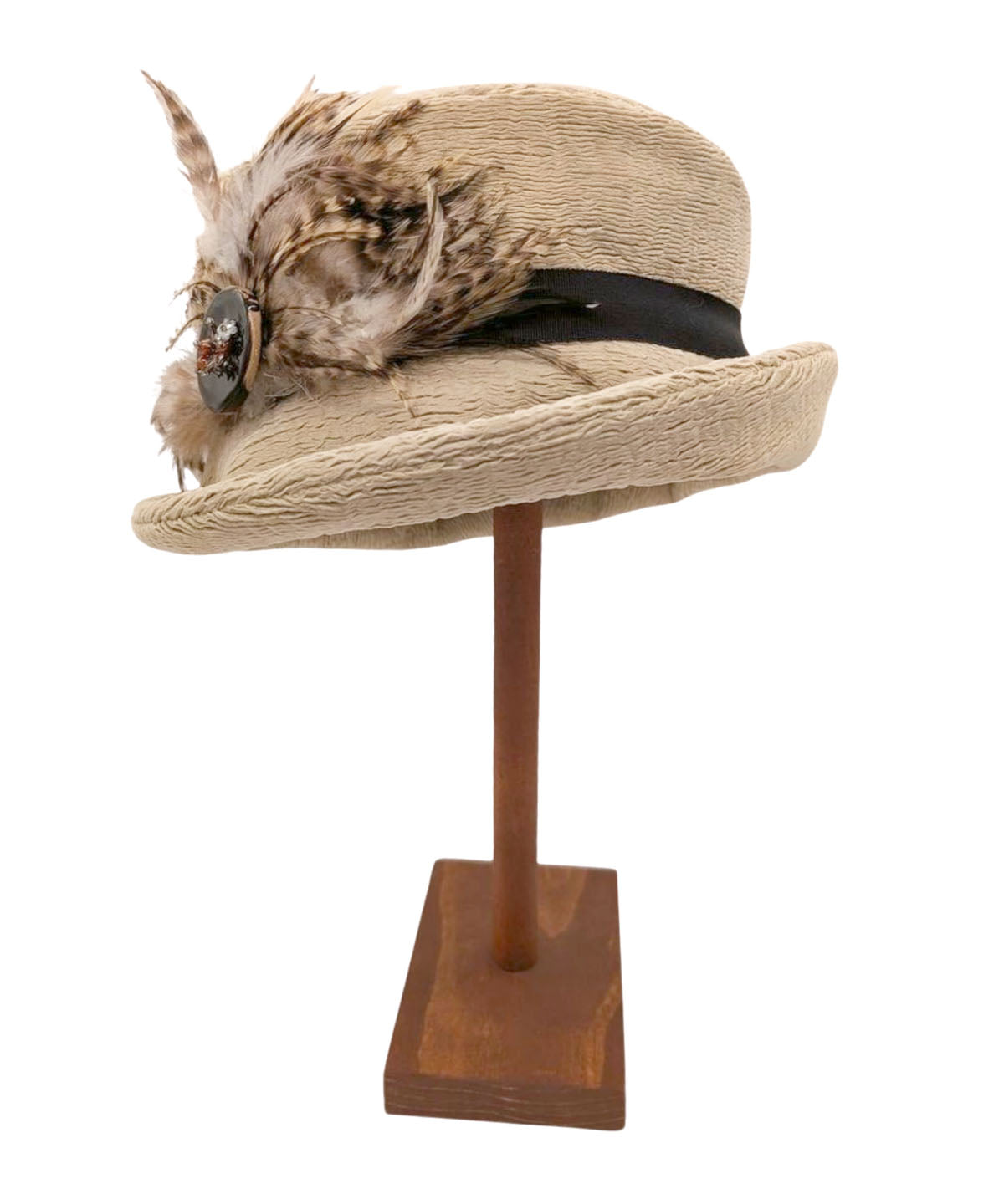 Product Shot of Molly Bucket Style Hat in Evolution in Putty Upholstery with a Chocolate Band featuring a Glass Beaded Button with Feathers with brim cuffed | By Pandemonium Millinery | Seattle WA USA