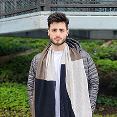 man wearing paneled scarf in neutral tones handmade by Pandemonium Seattle