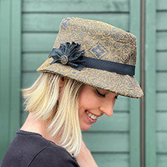 woman wearing fedora hat with black band handmade by Pandemonium Millinery Seattle USA