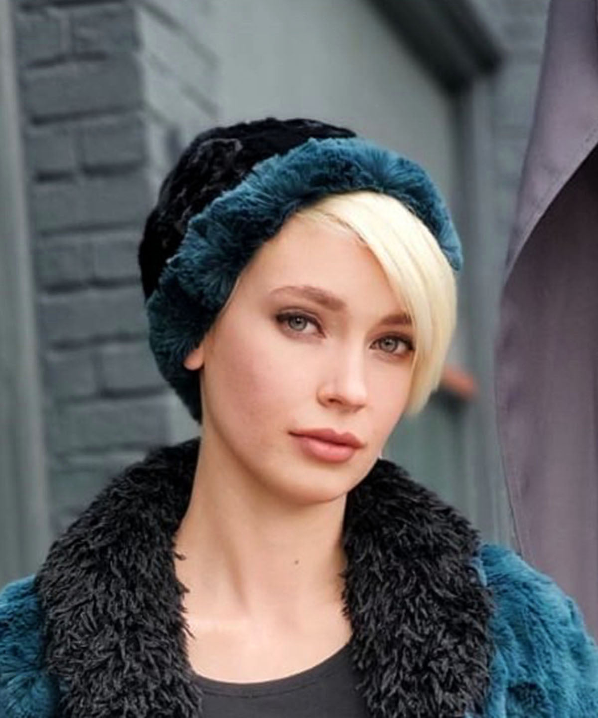 woman wearing a Two Tone Cuffed Pillbox, Reversible shown in Peacock Pond with Cuddly Black Faux Fur by Pandemonium Millinery. Handmade in Seattle, WA USA.