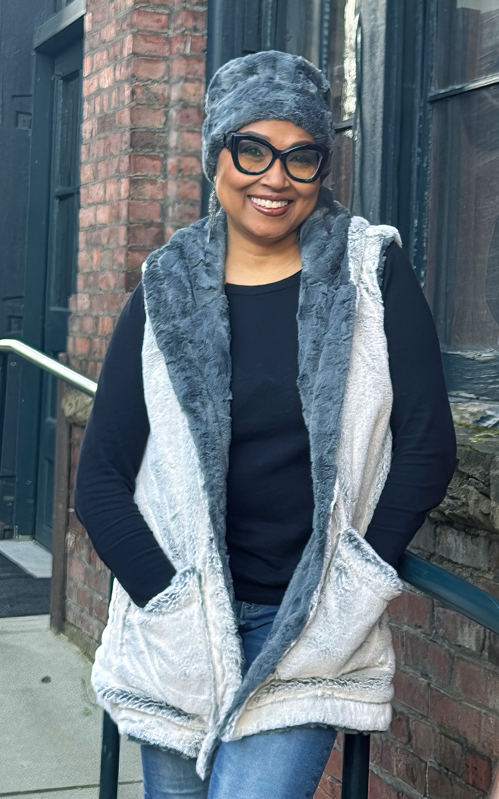 Woman modeling the Oversized Hooded Vest in in Frosted Juniper with Cuddly Slate faux fur | Handmade by Pandemonium Seattle.