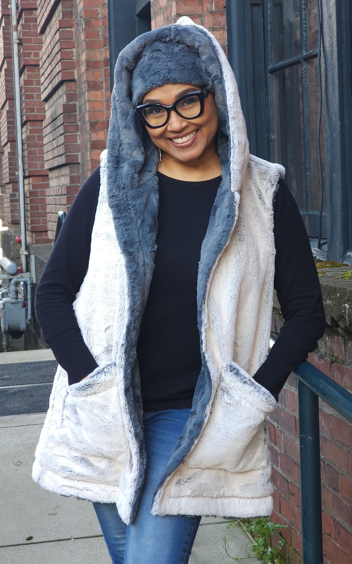 Woman modeling the Oversized Hooded Vest in in Frosted Juniper with Cuddly Slate faux fur | Handmade by Pandemonium Seattle.