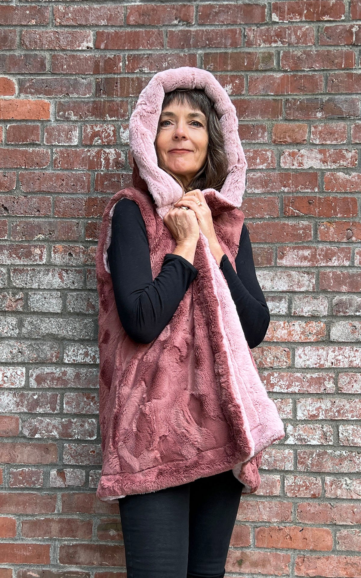 Woman modeling the Oversized Hooded Vest in in Frosted Juniper with Cuddly Slate faux fur | Handmade by Pandemonium Seattle.