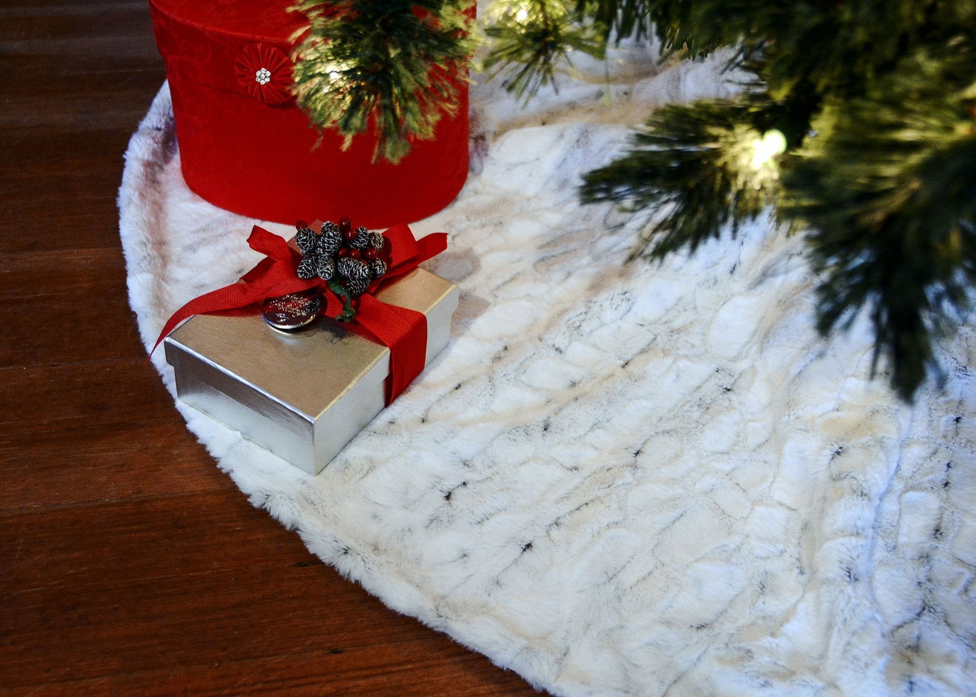 Custom Christmas tree skirt under a Holiday tree with gifts | Winter Frost Faux Fur with white lining  | Luxury Faux Fur Designer | Handmade by Pandemonium Millinery Seattle, WA usa