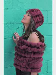 Woman wearing the shoulder wrap and ear neck cozy in Maple Glow in Royal Opulence faux fur. Made in Seattle, WA, USA by Pandemonium Seattle.