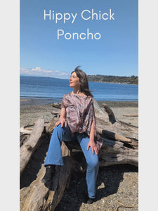 Video showing a woman wearing the Lumina Poncho in Hippy Chick at the beach. Made in Seattle, WA, USA by Pandemonium Seattle.