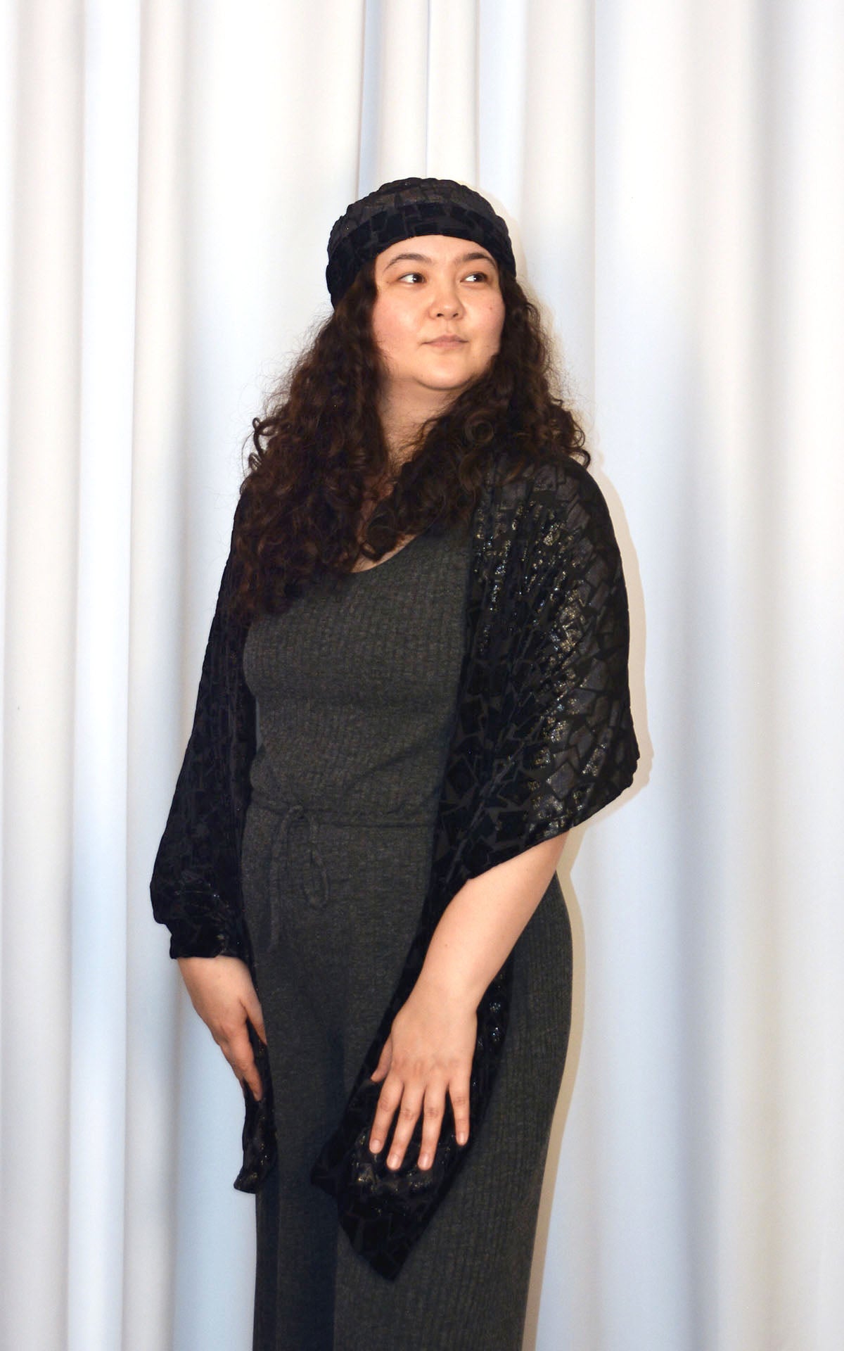 Woman wearing Grand Wrap with matching hat in Wild Nights, a sparkly, black, Burnout Velvet handmade in USA by Pandemonium Seattle