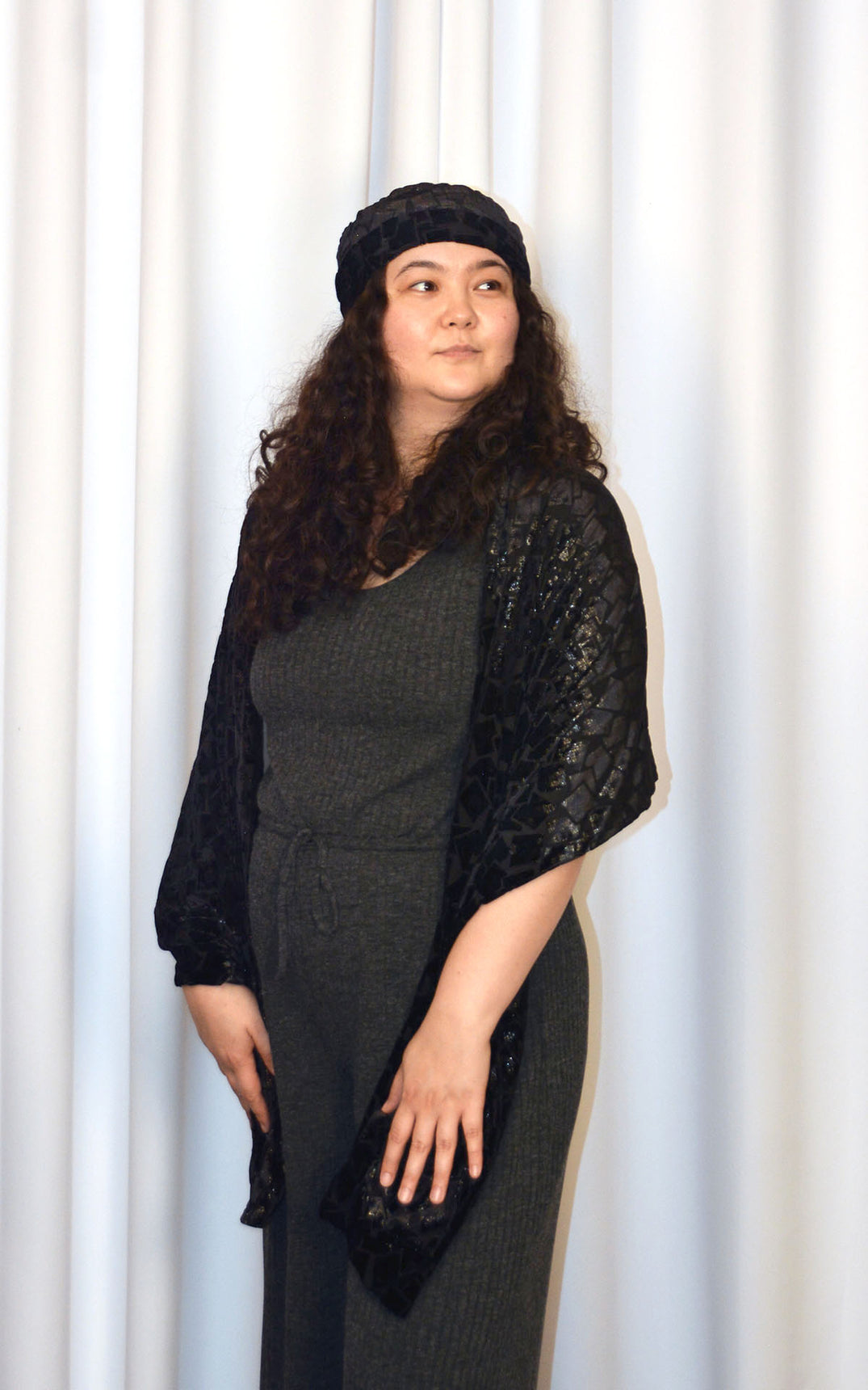 Woman wearing Grand Wrap with matching hat in Wild Nights, a sparkly, black, Burnout Velvet handmade in USA by Pandemonium Seattle