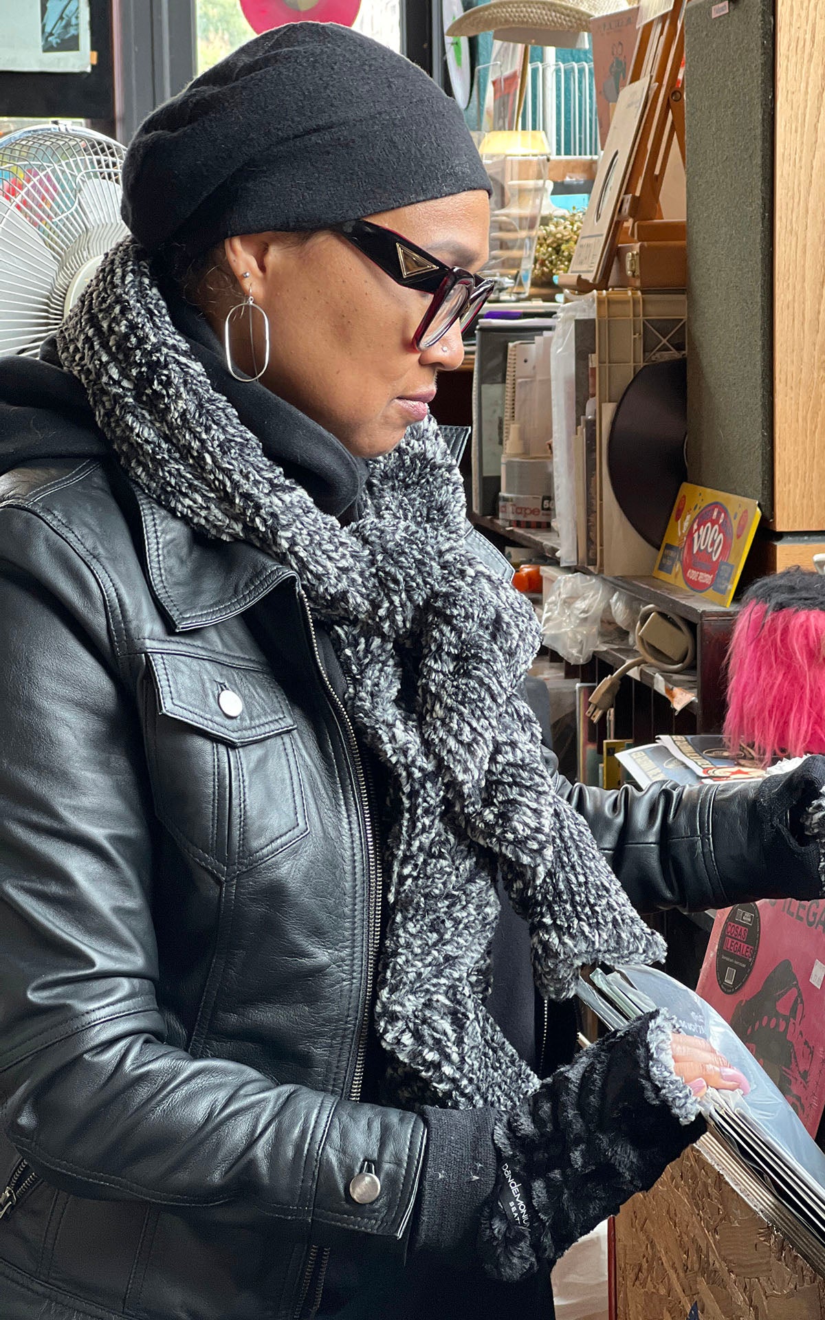 Model wearing Scrunchy Scarf in Cozy Cable faux fur looking through records | Handmade in USA by Pandemonium Seattle