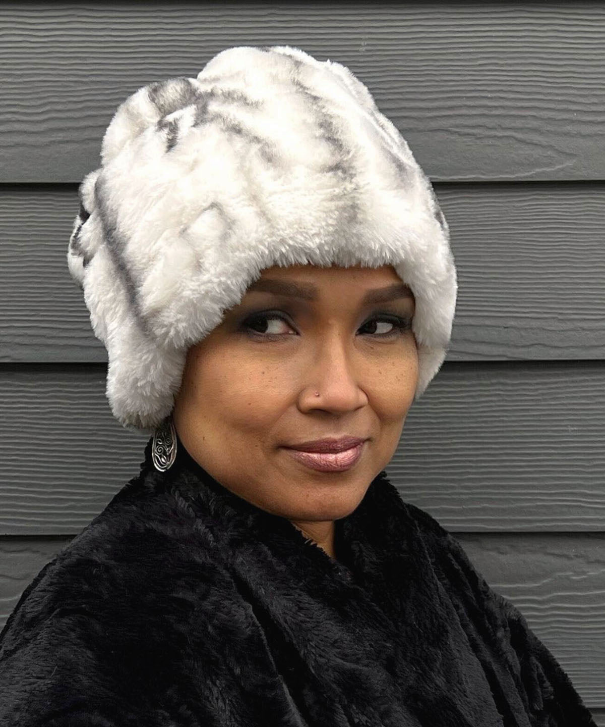 Woman wearing the Faux Fur Beanie Hat in Aspen. The fabric is from the Royal Opulence Faux Furs. Pandemonium is located in Seattle, WA.