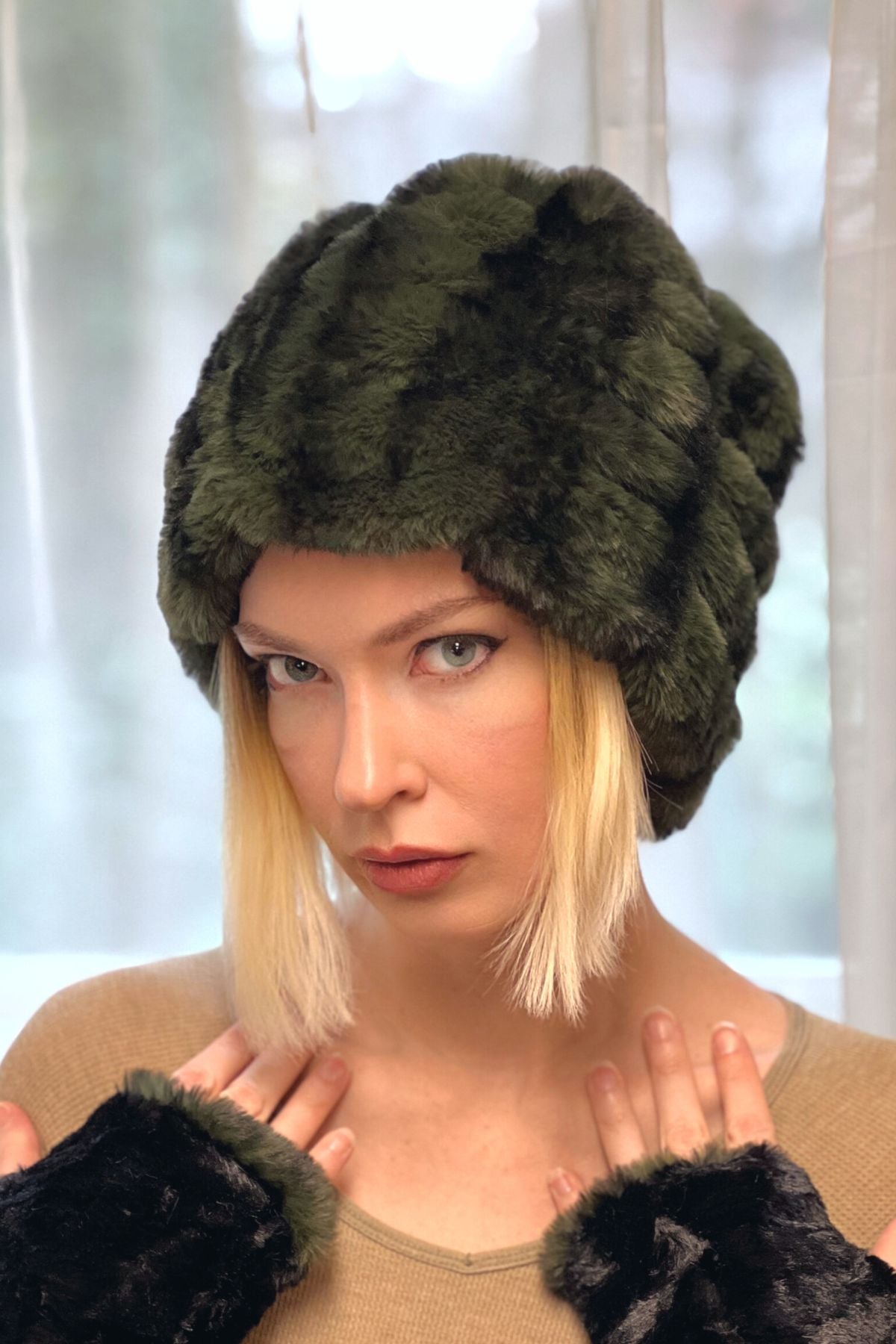 Model wearing the Faux Fur Beanie Hat in Black Pine with matching Fingerless Gloves. The fabric is from the Royal Opulence Faux Furs. Pandemonium is located in Seattle, WA