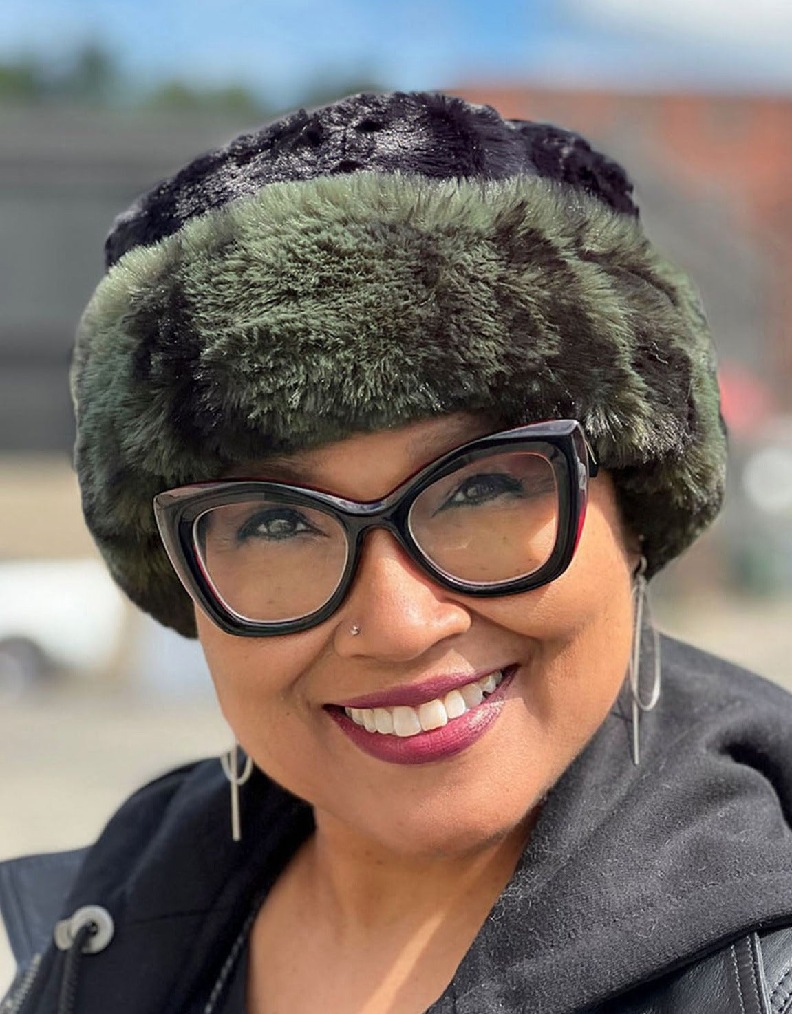 Woman wearing a Royal Opulence Cuffed Pillbox in Black Pine and Cuddly Black. Handmade by Pandemonium Seattle.