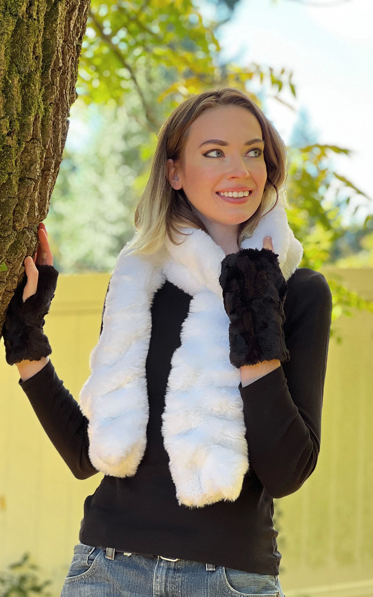 Model is wearing a Royal Opulence Maple Glow faux fur Scarf with matching Fingerless gloves and a Cloche hat by Pandemonium Seattle.