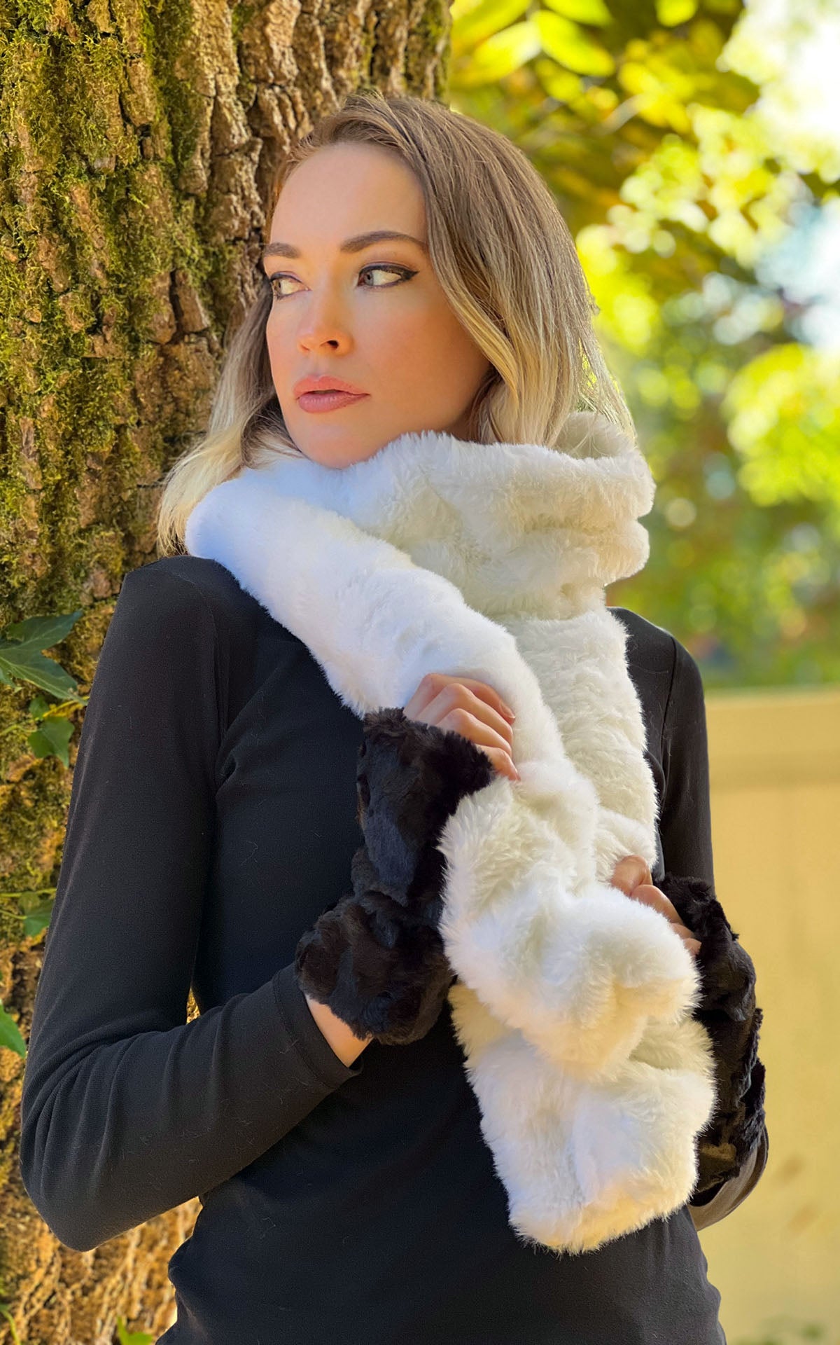 Woman wearing black gloves paired with Heavenly Faux Fur Scarf from the Royal Opulence Collection by Pandemonium Seattle.