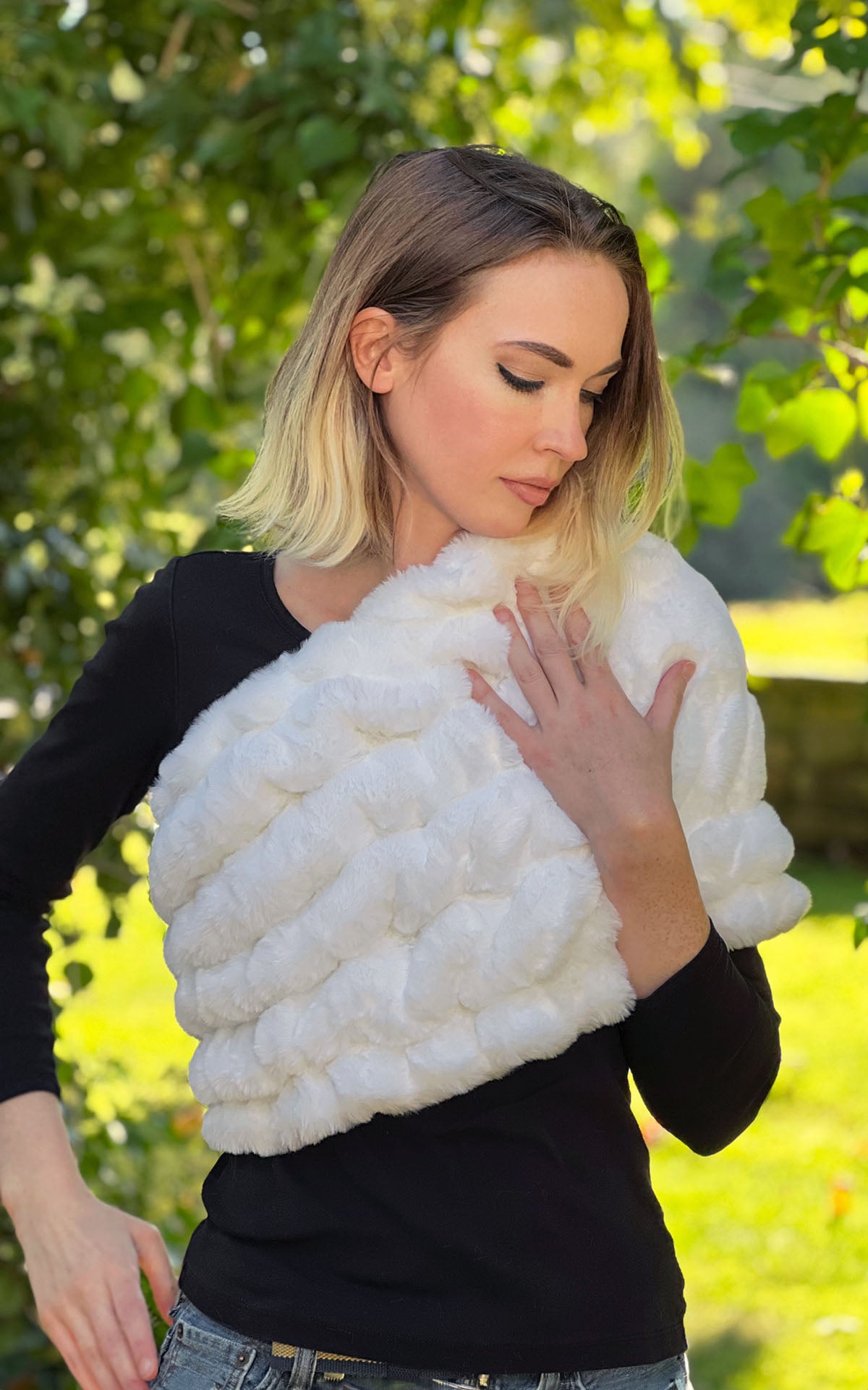 Model with wine glass wearing Royal Opulence Mink Gray Faux Fur Shoulder Wrap by Pandemonium Seattle.