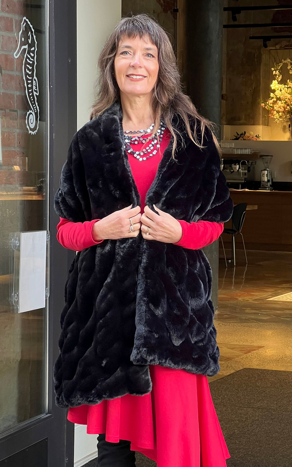Woman wearing Royal Opulence Stole in Onyx. Handmade by Pandemonium Seattle.