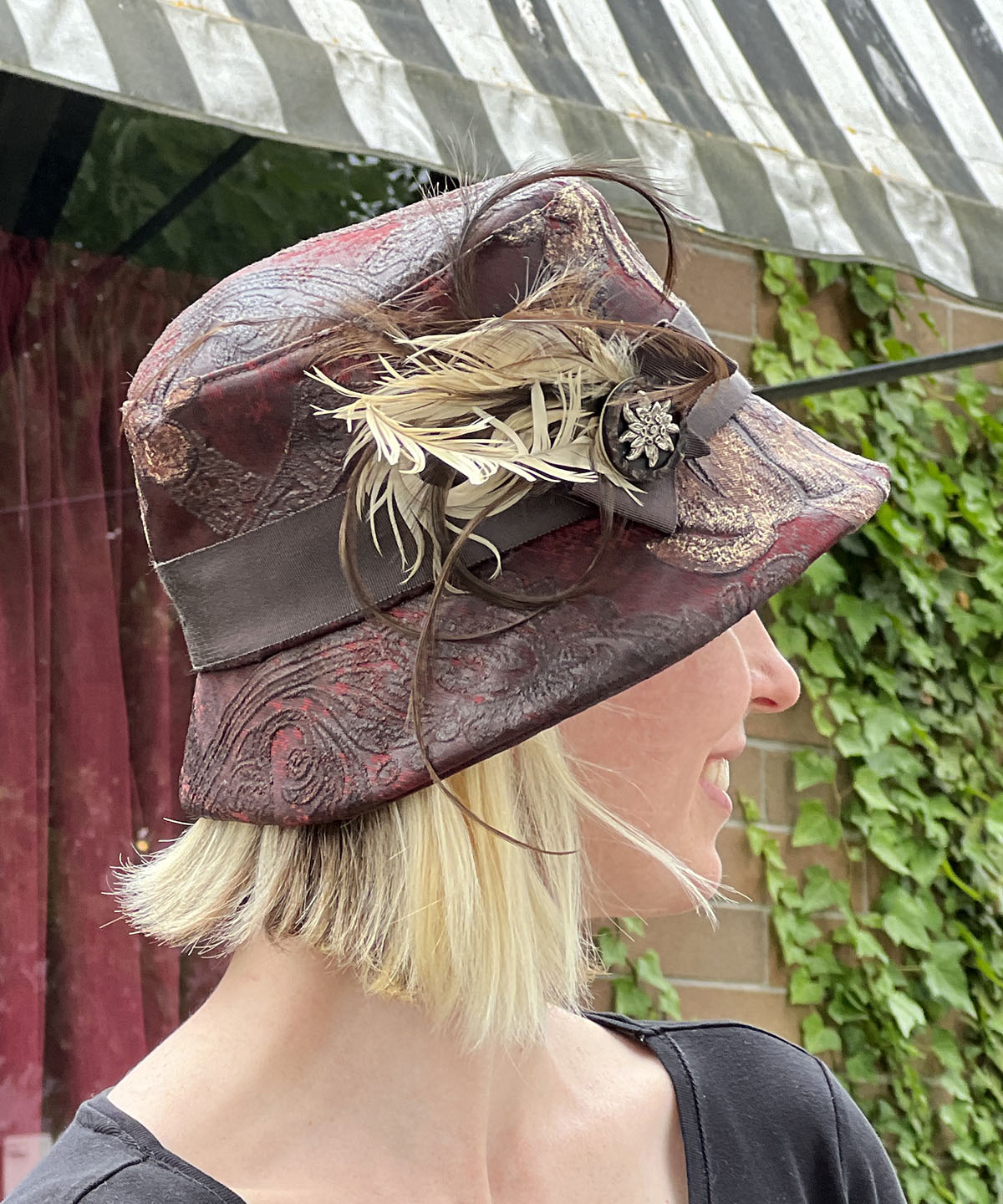 Back View of Samantha Bucket Hat | Renaissance In Ox Blood Upholstery | Feather and Button Brooch | Handmade in Seattle, WA USA by Pandemonium Millinery