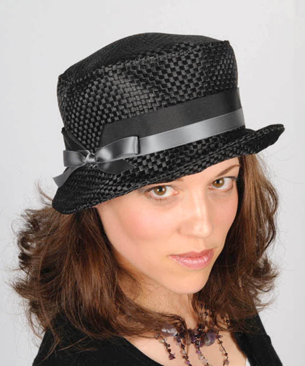 Model wearing Samantha Hat | Interconnected in Black | Black Grosgrain and Silver Satin Band with Bow | Handmade By Pandemonium Millinery | Seattle WA