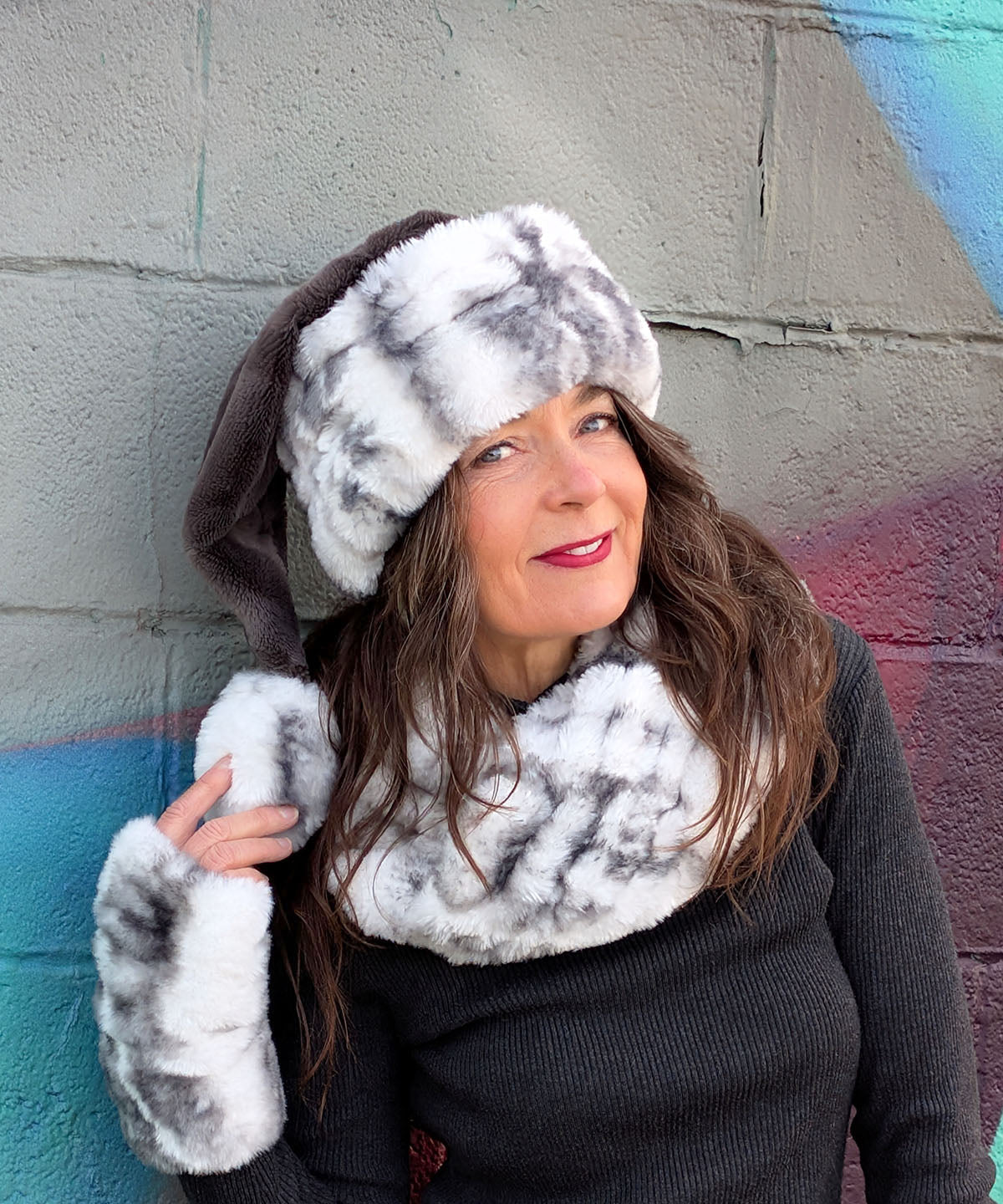 Close Up View of Model wearing Santa Hat | Royal Opulence in Aspen Faux Fur | Featuring matching Fingerless Gloves-Mids and Neckwarmer | Pandemonium Seattle | Handmade in Seattle WA