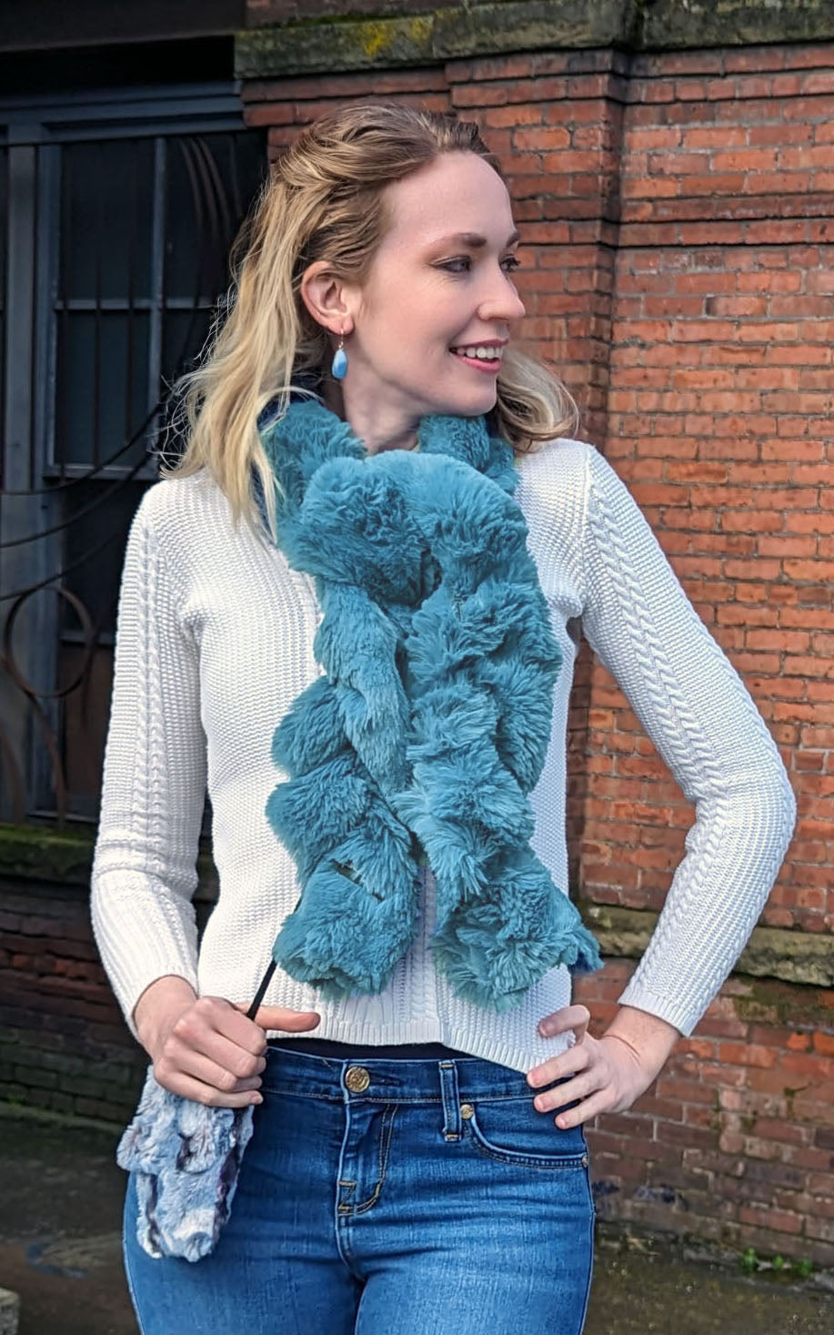 Model wearing Enchanted Dreams in Bluebell Scrunchy Scarf. Enchanted Dreams Faux Fur Scrunchy Scarf is handmade in Seattle, WA, USA by Pandemonium Seattle.