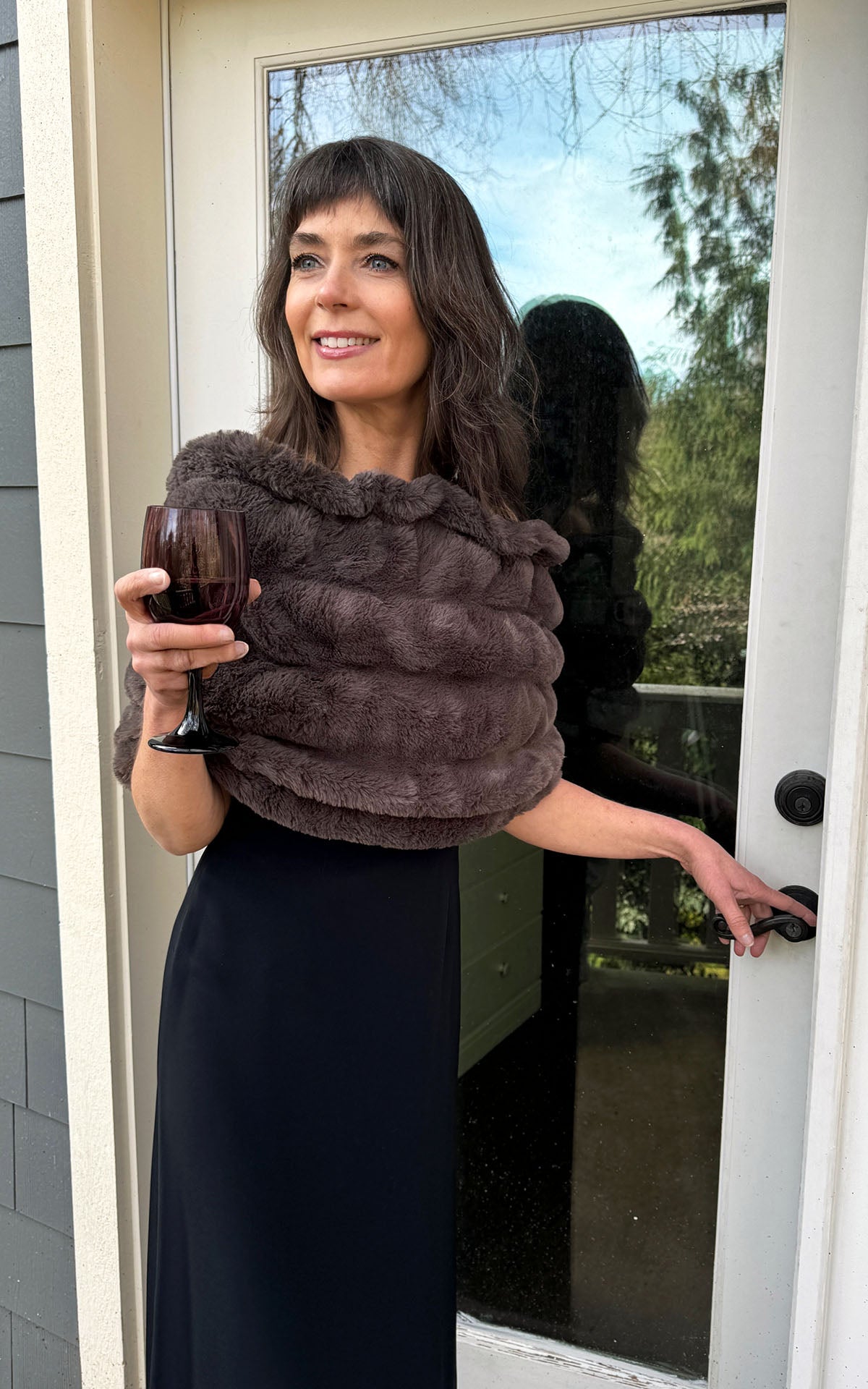 Model in dress wearing Royal Opulence Mink Gray Faux Fur Shoulder Wrap by Pandemonium Seattle.