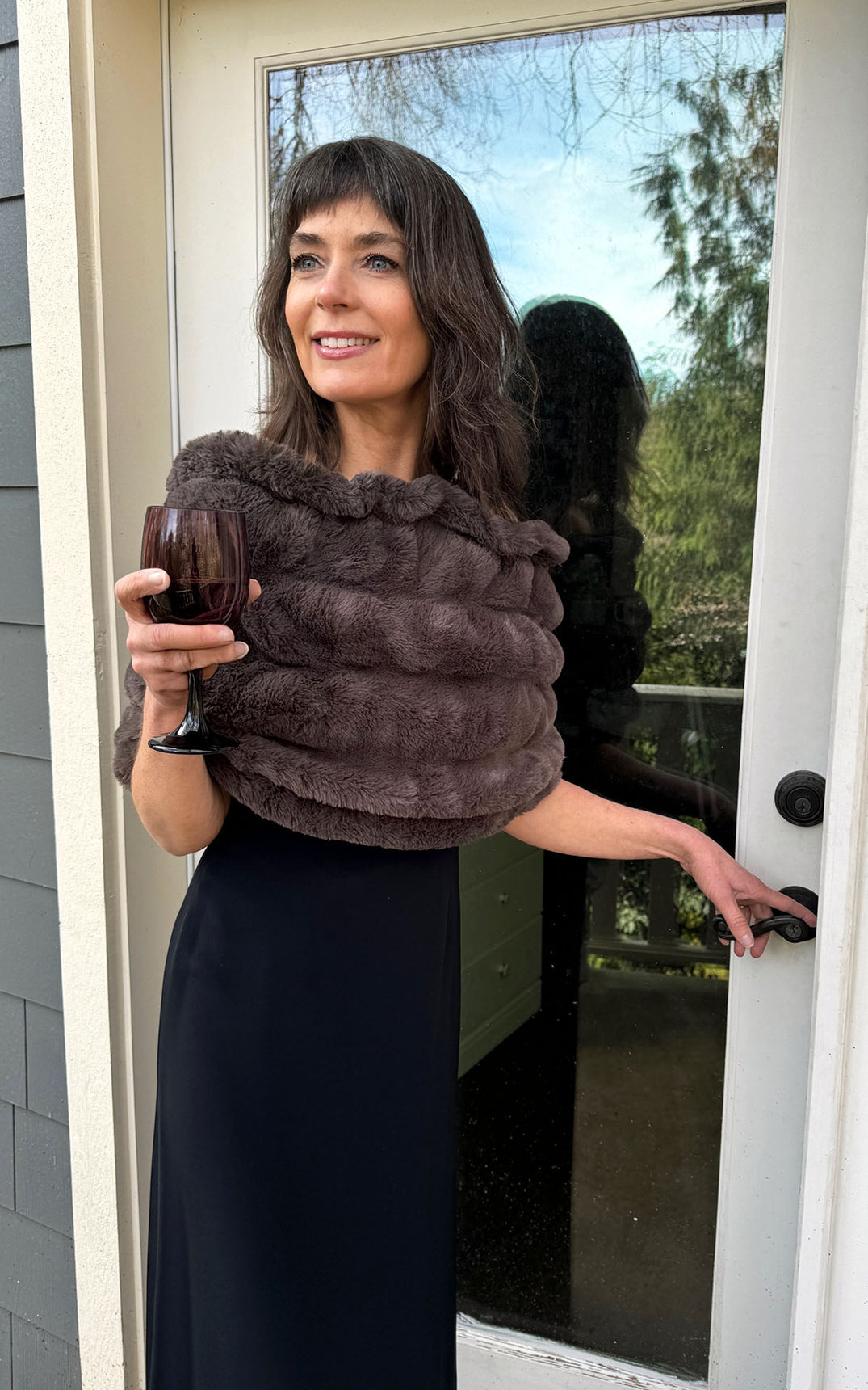 Model in dress wearing Royal Opulence Mink Gray Faux Fur Shoulder Wrap by Pandemonium Seattle.