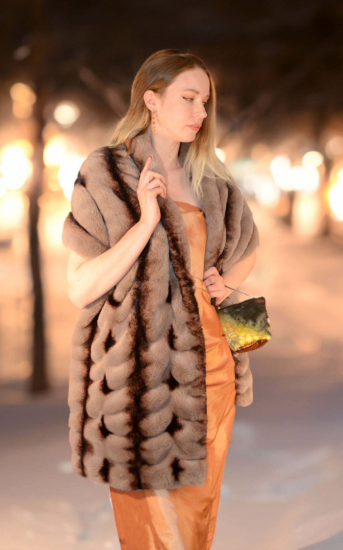 Woman wrapped in the Royal Opulence Stole in Taupeful around her shoulders. Handmade by Pandemonium Seattle.