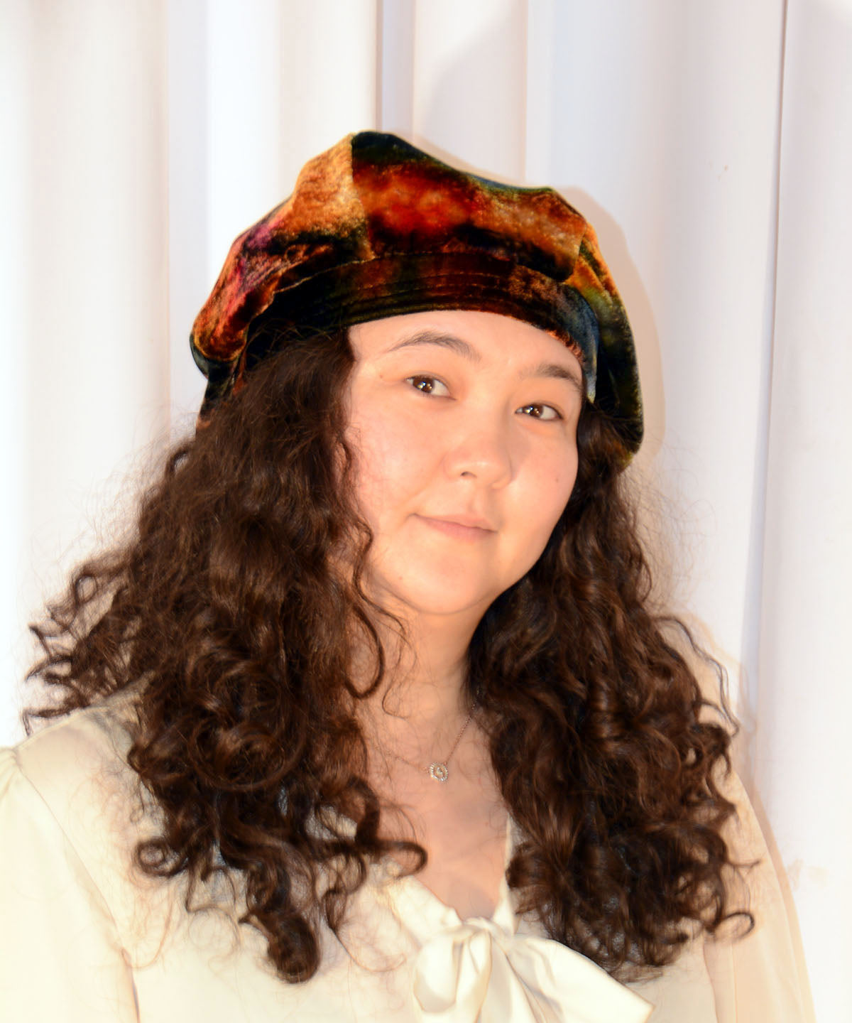 Model playing with hair wearing Oversize Beret Hat in Velvet in Hippy Tie Dye | Handmade by Pandemonium Millinery | Seattle WA USA