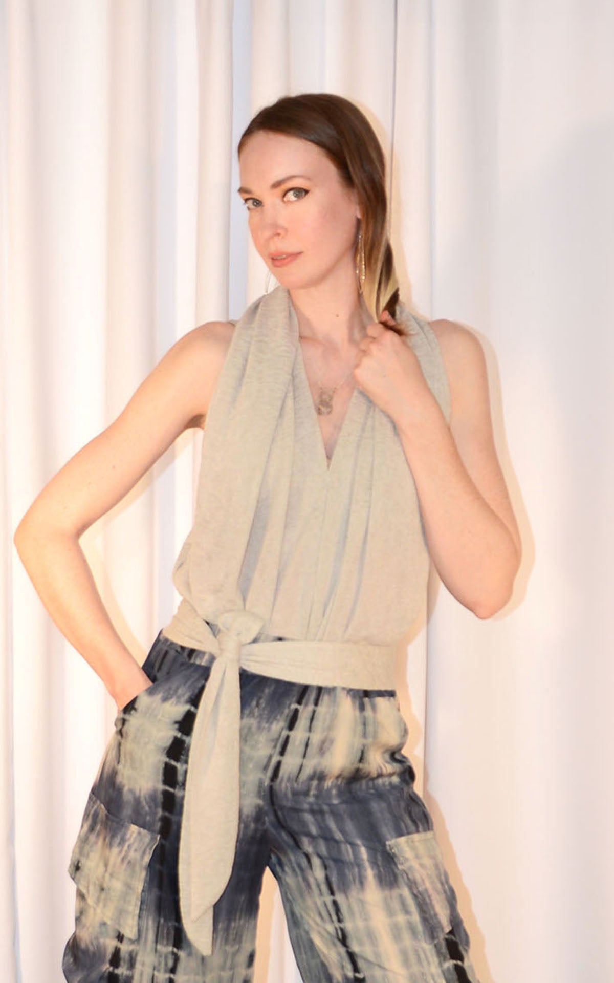 close up of woman wearing swallowtail sash top in sandstone desert crepe with cargo pants in blue tea handmade by LYC x Pandemonium in Seattle, WA, USA