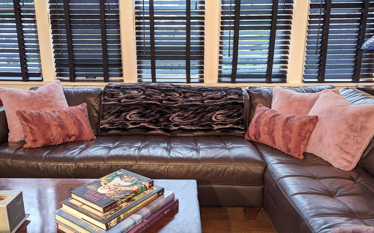 Living room with Throw in Black Marble Dune Faux Fur and pink faux fur pillows handmade in Seattle, WA USA by Pandemonium Millinery