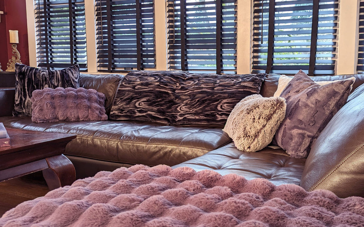 Living room with Throw in Black Marble Dune Faux Fur and assorted decorative pillows handmade in Seattle, WA USA by Pandemonium Millinery