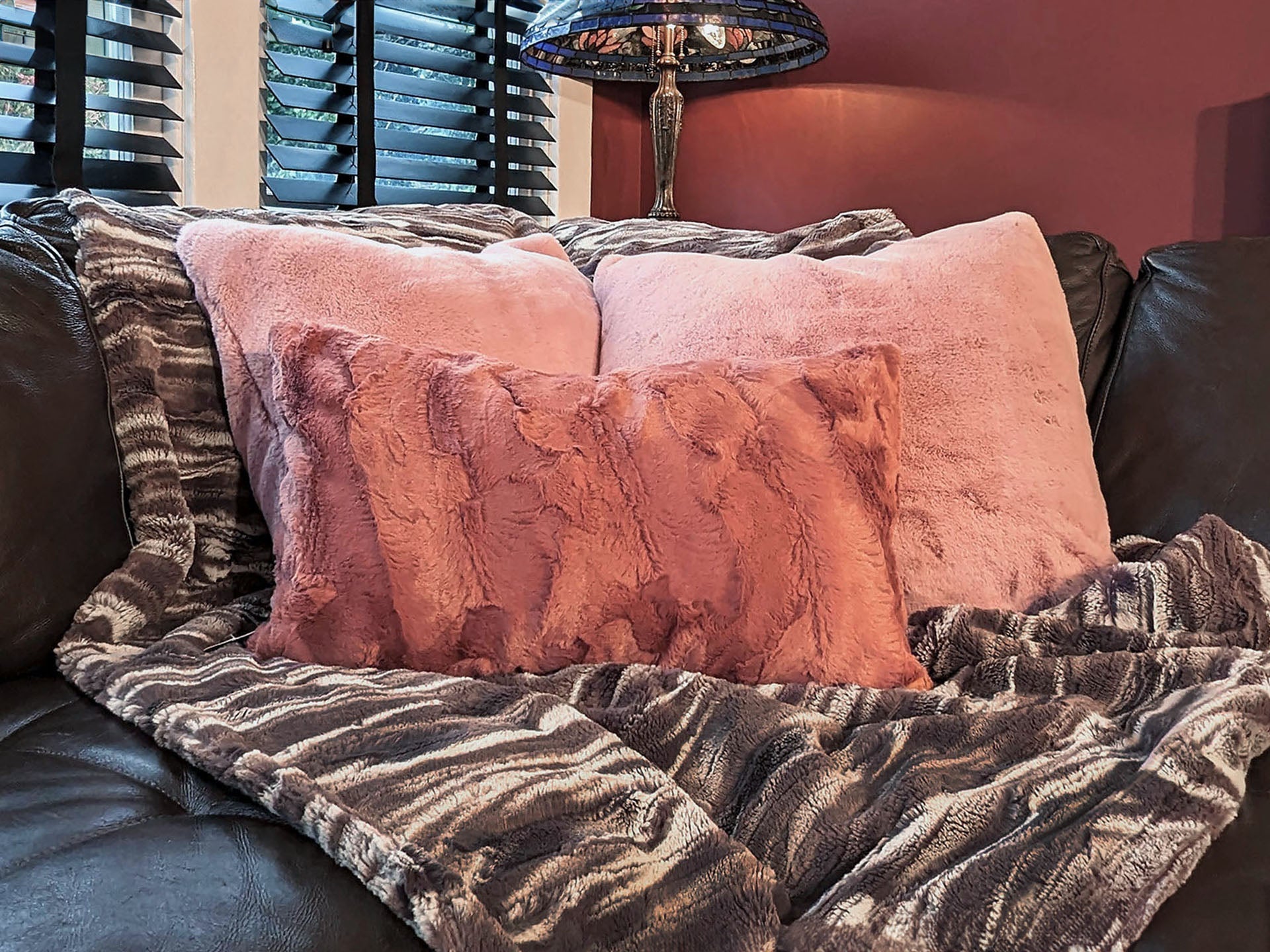 couch with a white and gray faux fur throw and pink pillows handmade in the USA by Pandemonium Seattle