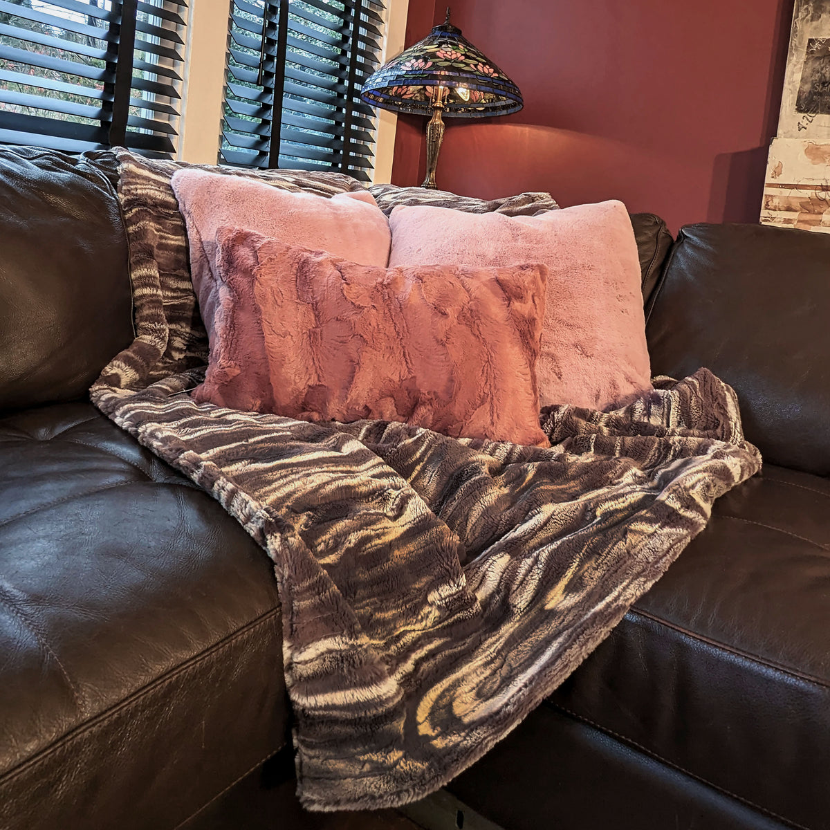 Living room with Throw in Gray Marble Dune Faux Fur with pink faux fur pillows handmade in Seattle, WA USA by Pandemonium Millinery