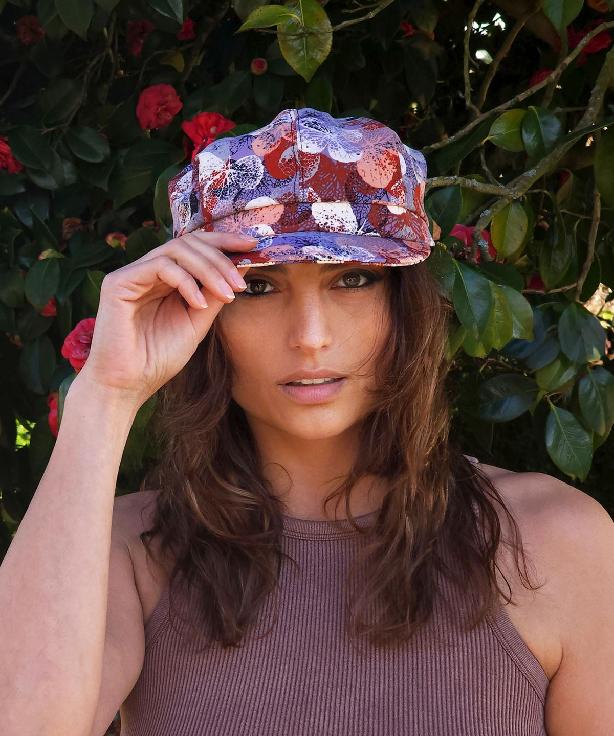 Woman wearing Valerie Newsboy Cap | Paper Flowers in Paprika | Pandemonium Millinery Handmade USA