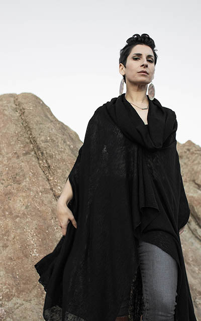 Model is wearing the Badlands Cloak in Scorpion with hood down. By Leigh Young Collection handmade in Seattle WA