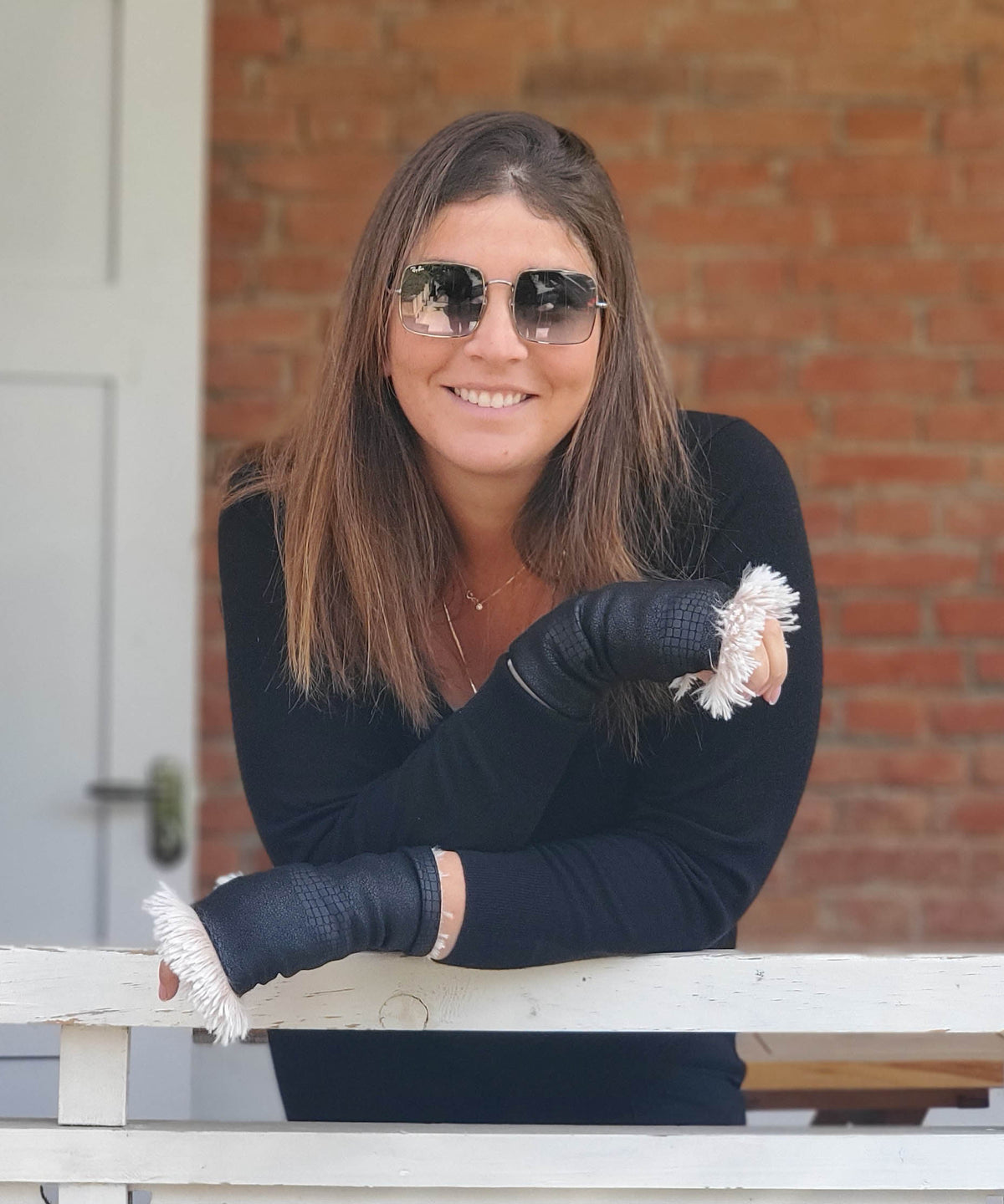 woman wearing Reversible Fingerless Gloves | Vegan Leather Outback in Black with Foxy Beach Faux Fur | Pandemonium Millinery